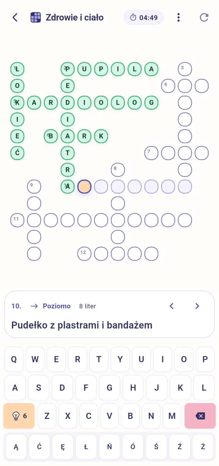 Krzyżówka „Zdrowie i ciało” w trakcie rozwiązywania, z podpowiedzią i polską klawiaturą